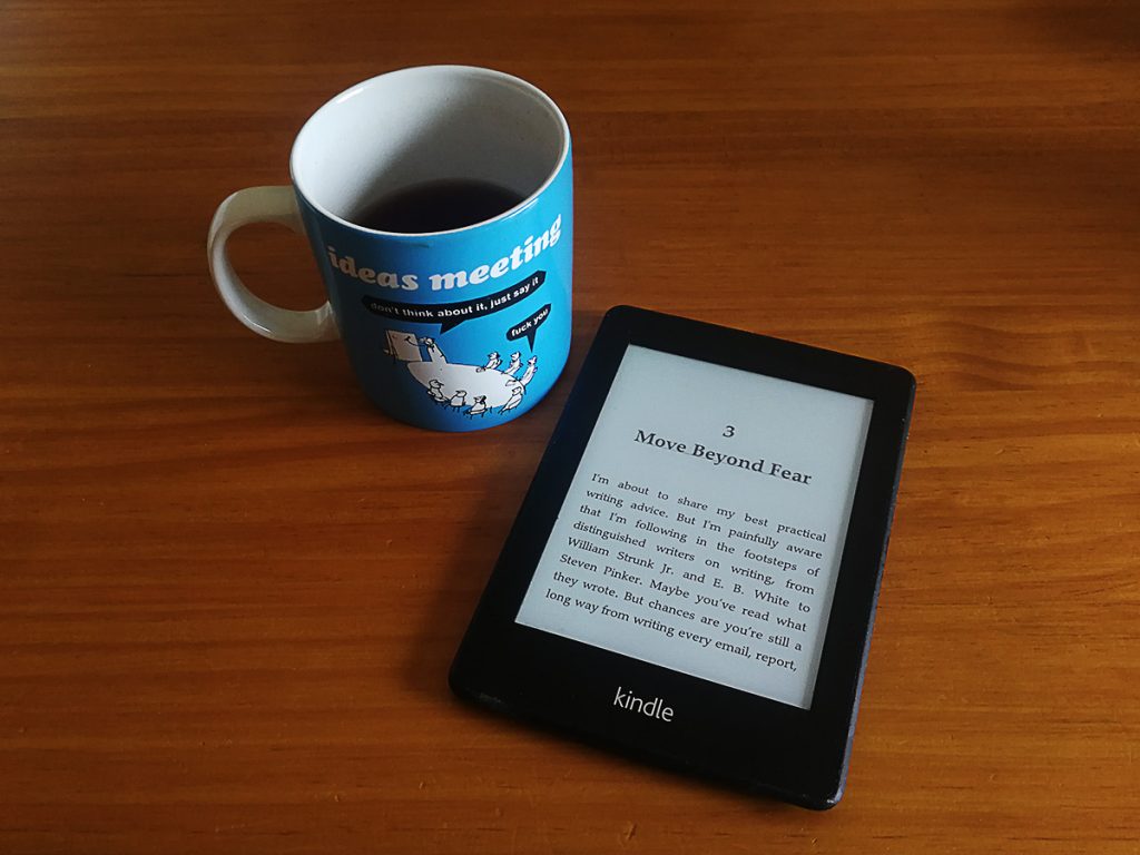 Tim Horans's kindle e-Reader beside a mug of tea.